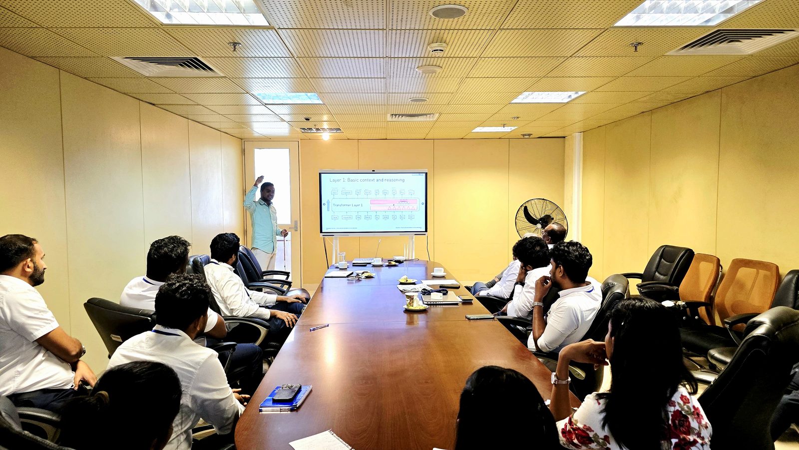 Senior customs officials around a boardroom table following the AI foundations presentation